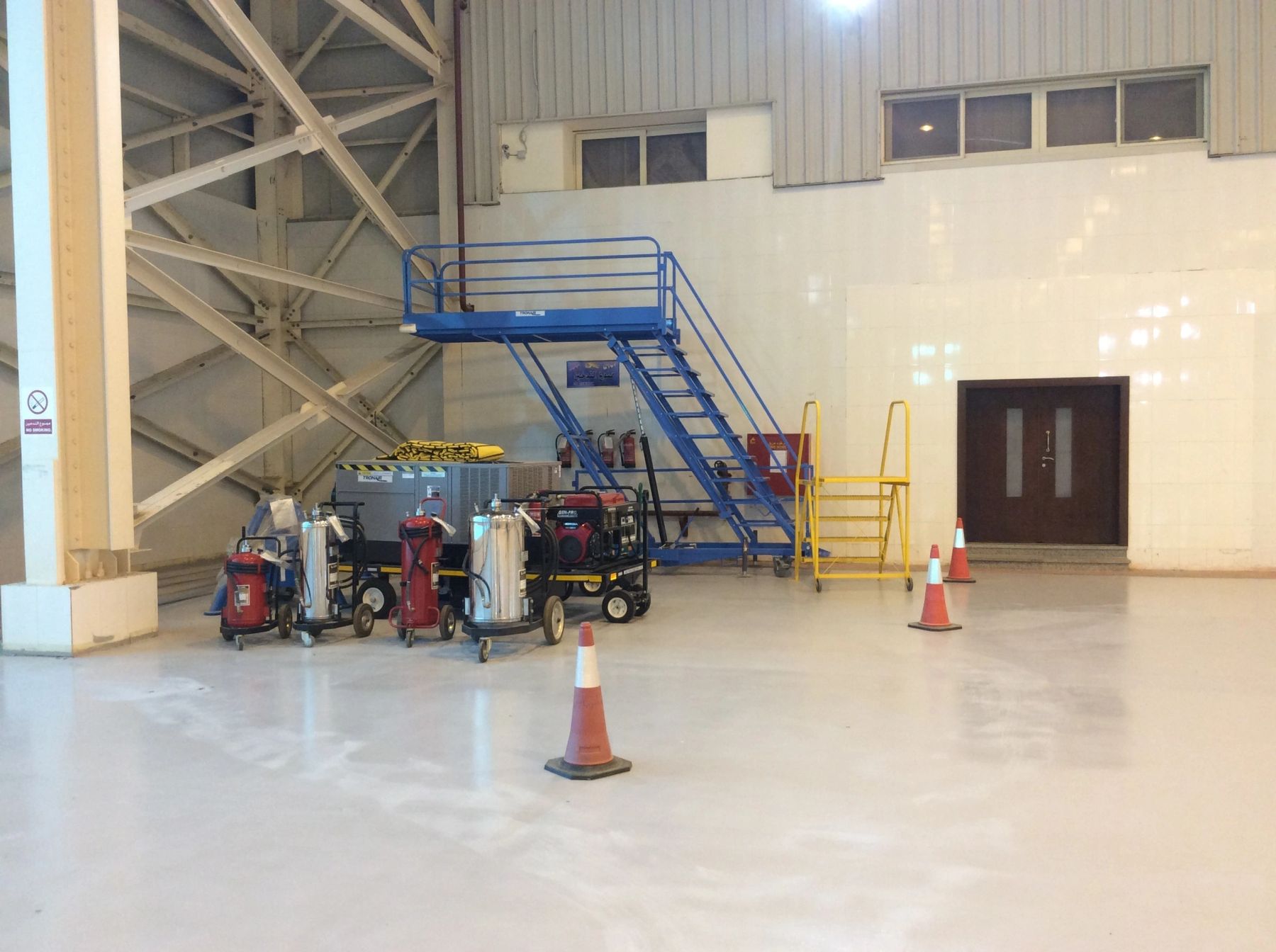 Inside the hangar with maintenance equipment
